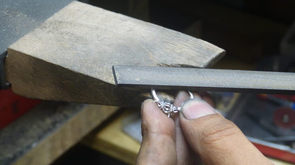 Jeweller hand-finishing a bespoke engagement ring in the Aardvark workshop