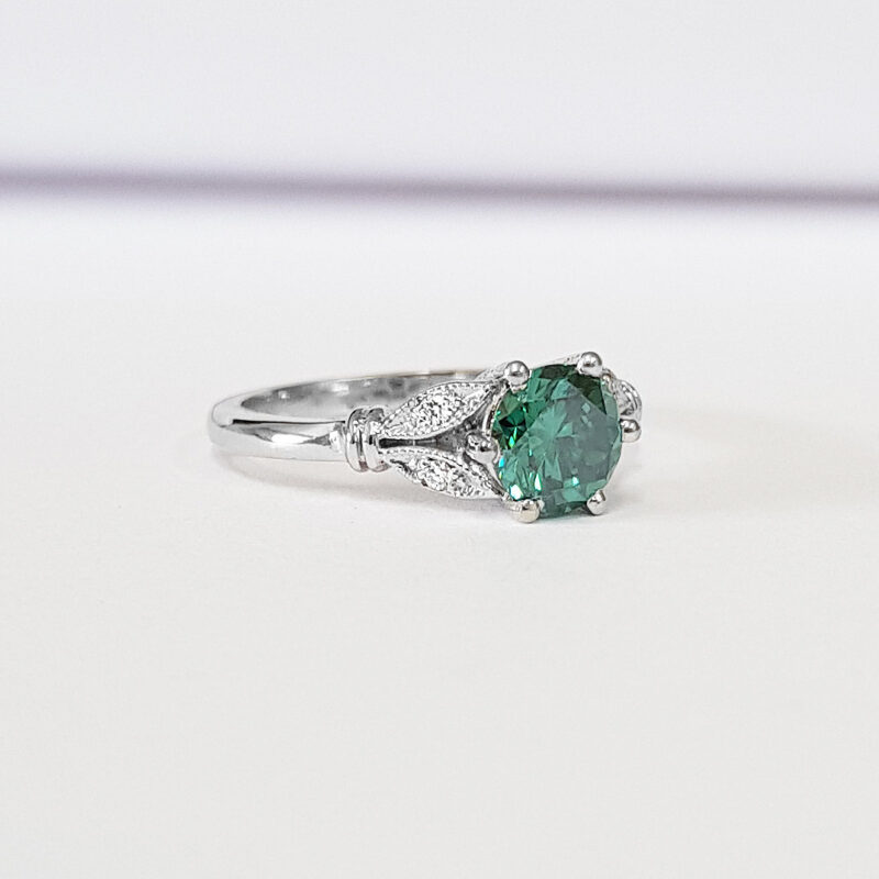 Teal green moissanite and diamond round engagement